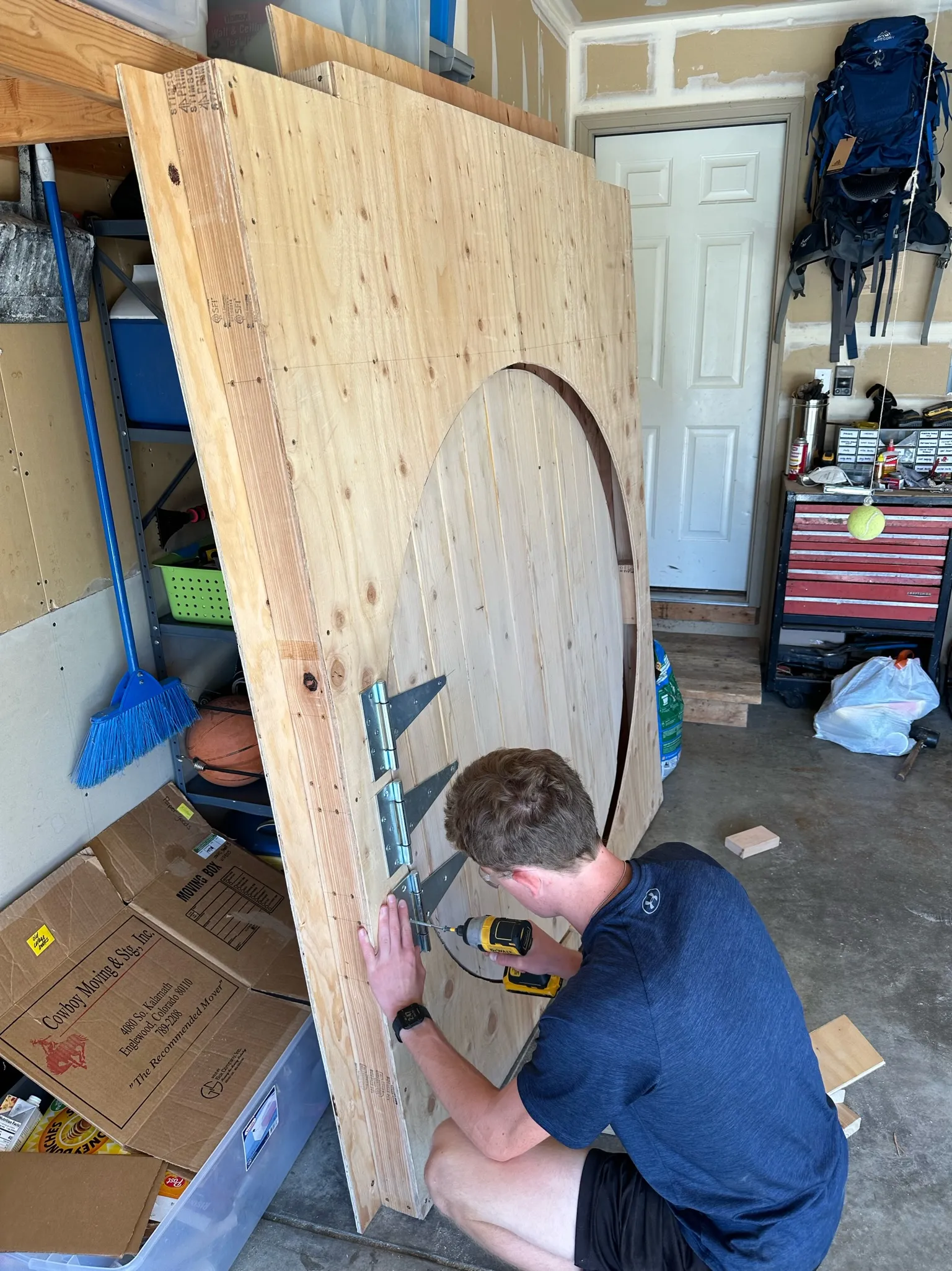 Cutting the circular door out of the panel with a jigsaw