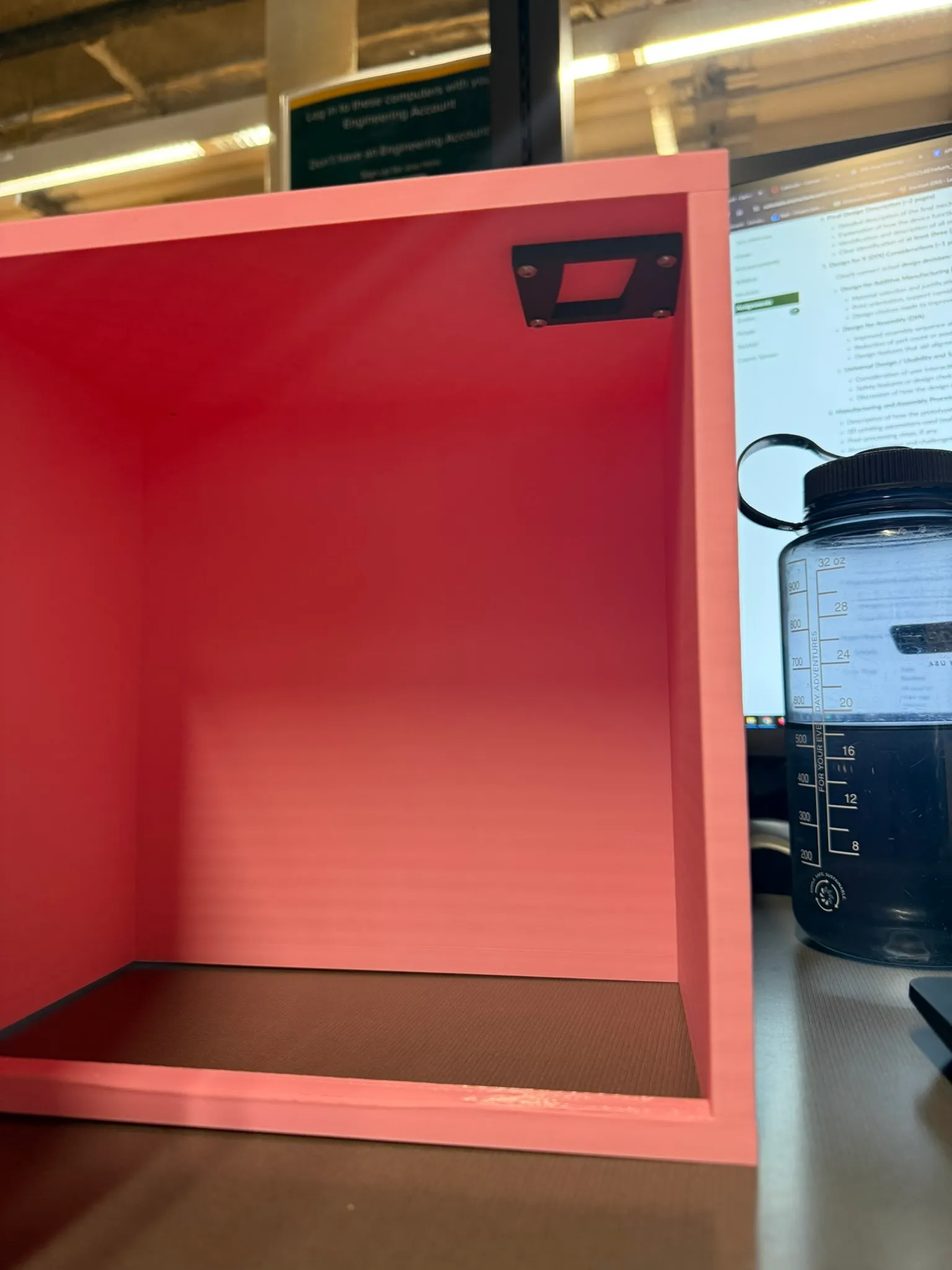 The cabinet door open, with the latch clear of its catch