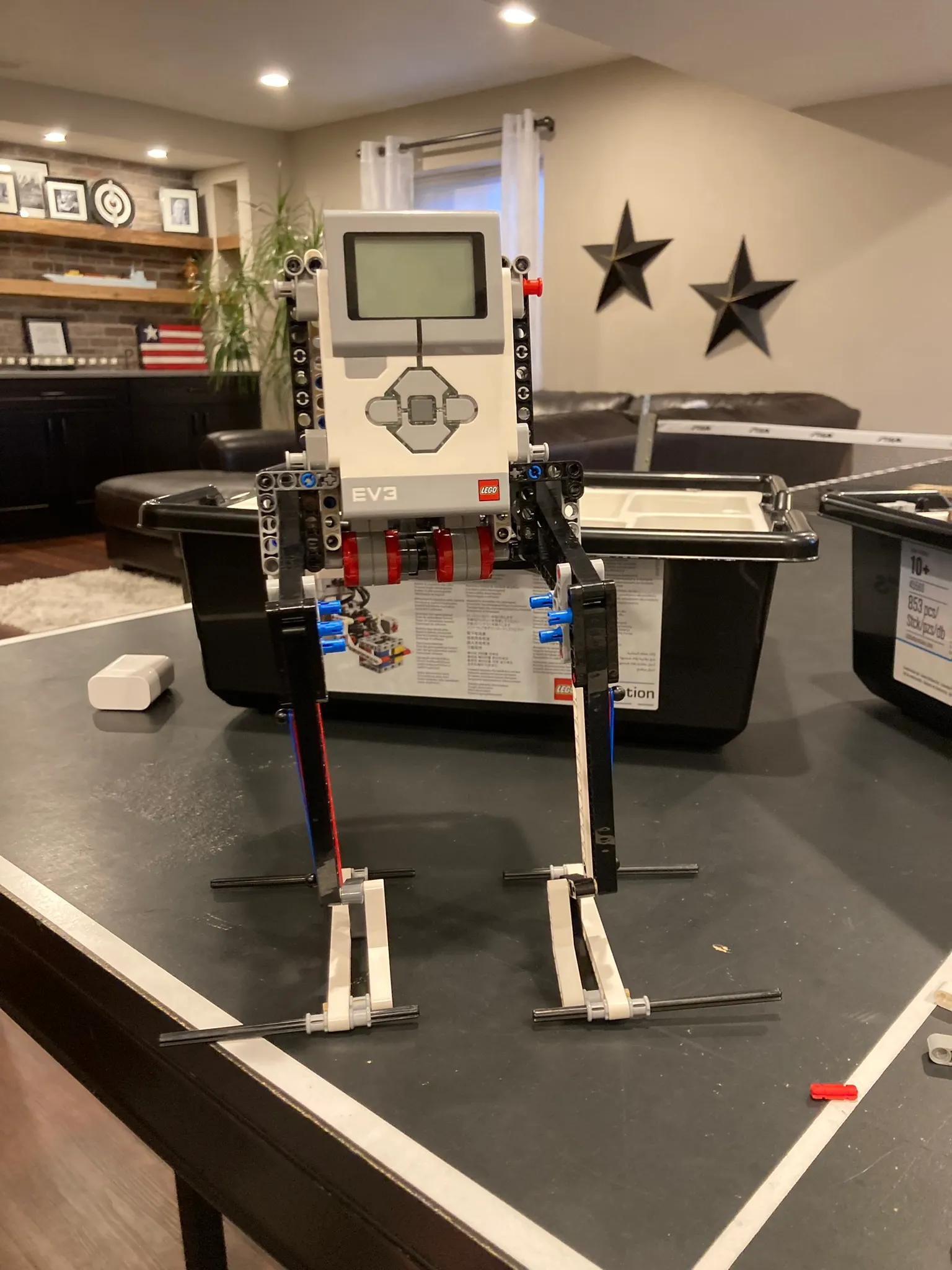 LEGO Technic and EV3 prototype of the walker standing on a table