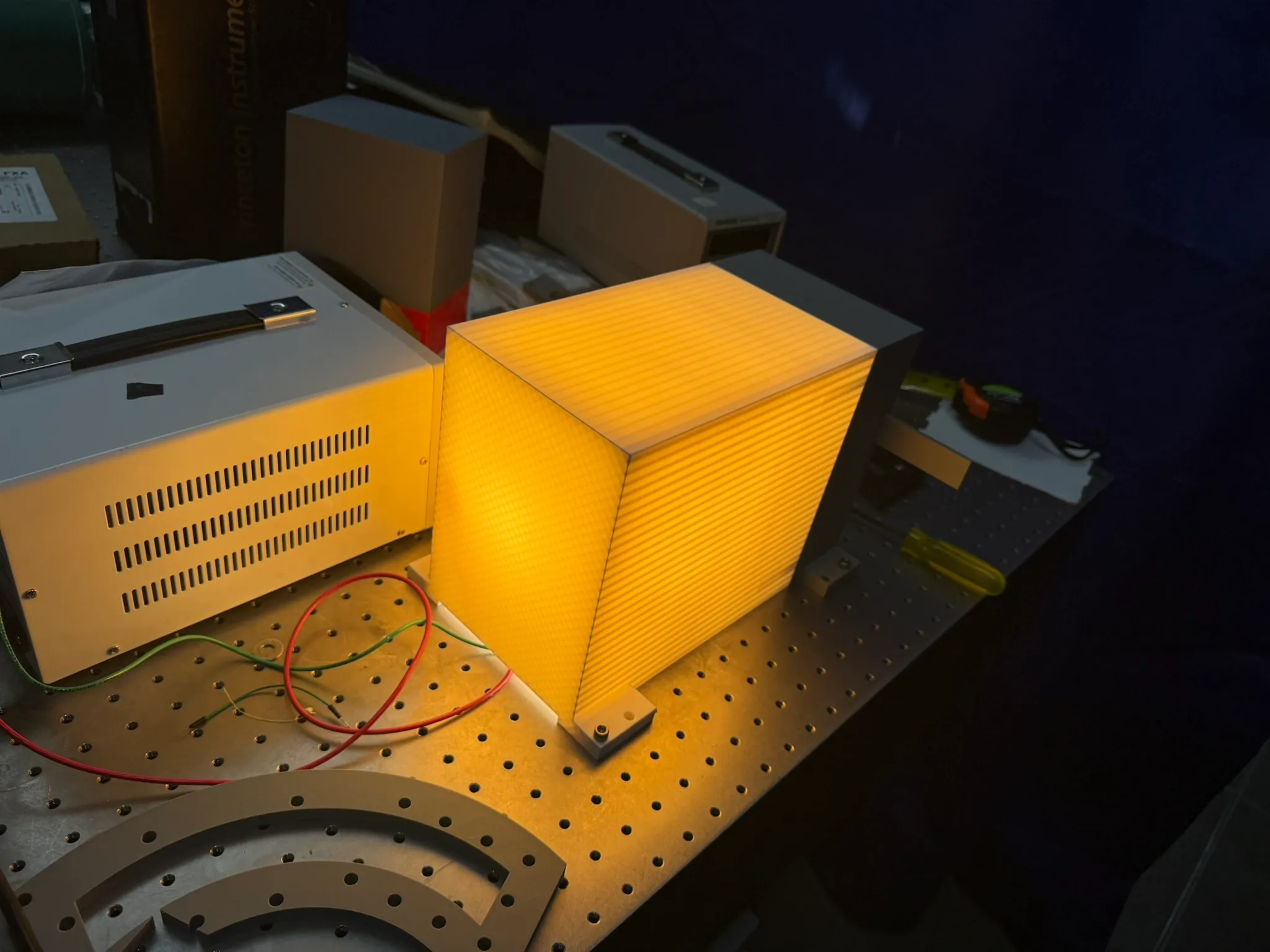 The illuminated light shield on the optical breadboard