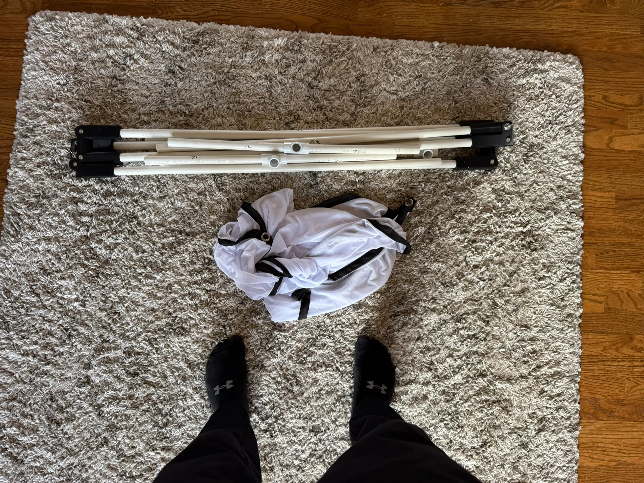 The frame disassembled into a bundle of PVC sections