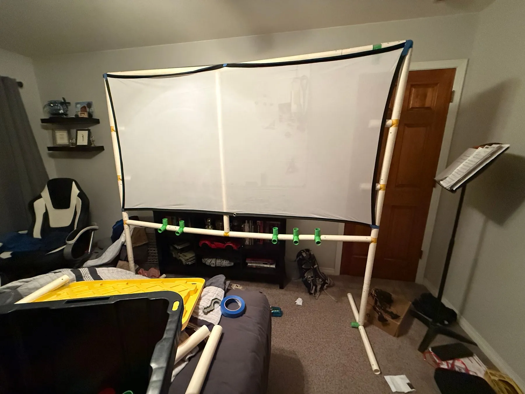 The first prototype: a frame built from a pipe-connecting toy kit, with the cloth screen attached